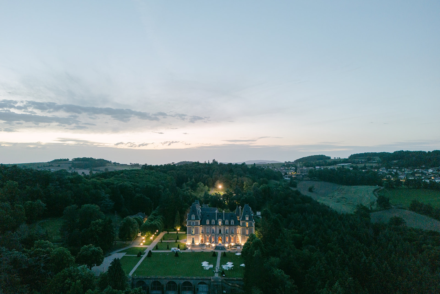 A drone image taken in the evening of Domaine des Halles in France, with a destination wedding taking place on the grounds, planning by Julian Leaver Events