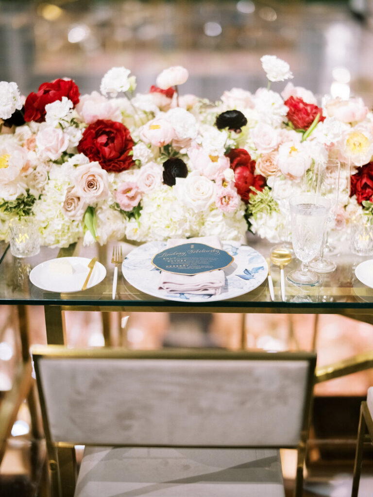 Gold chairs with suede with long tables covered in roses, hydrangeas, and anemones. At Rosewood in Dallas, to inspire your Napa wedding