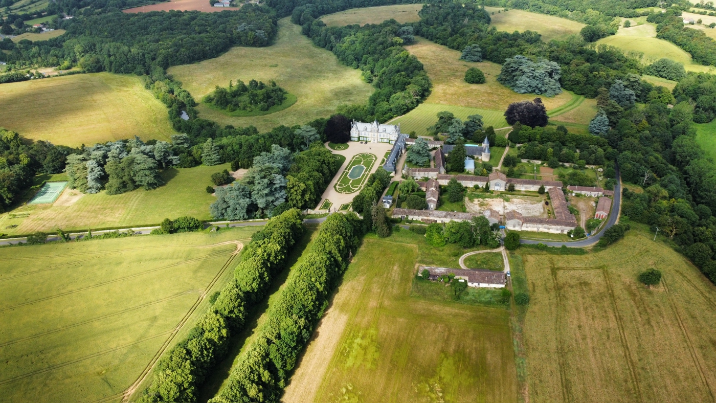 A drone view of Château de Curzay for a French Chateau wedding, planned by Julian Leaver Events.